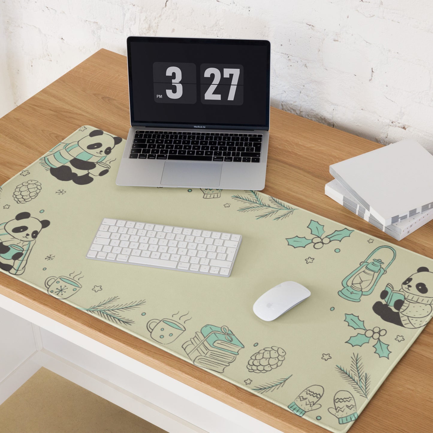 Extended cottagecore gaming desk mat with winter panda design on wooden desk setup with MacBook laptop, wireless keyboard and mouse, showing aesthetic workspace organization