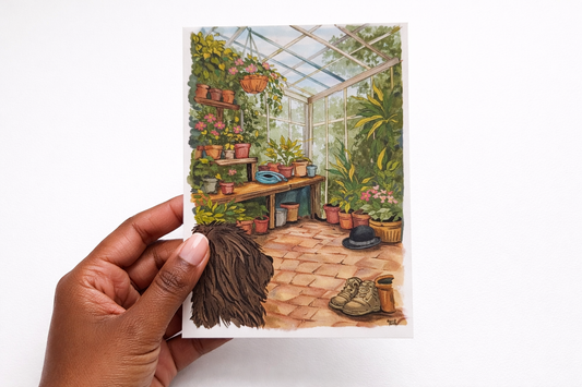 Illustrated postcard of a greenhouse held by a hand on a white background