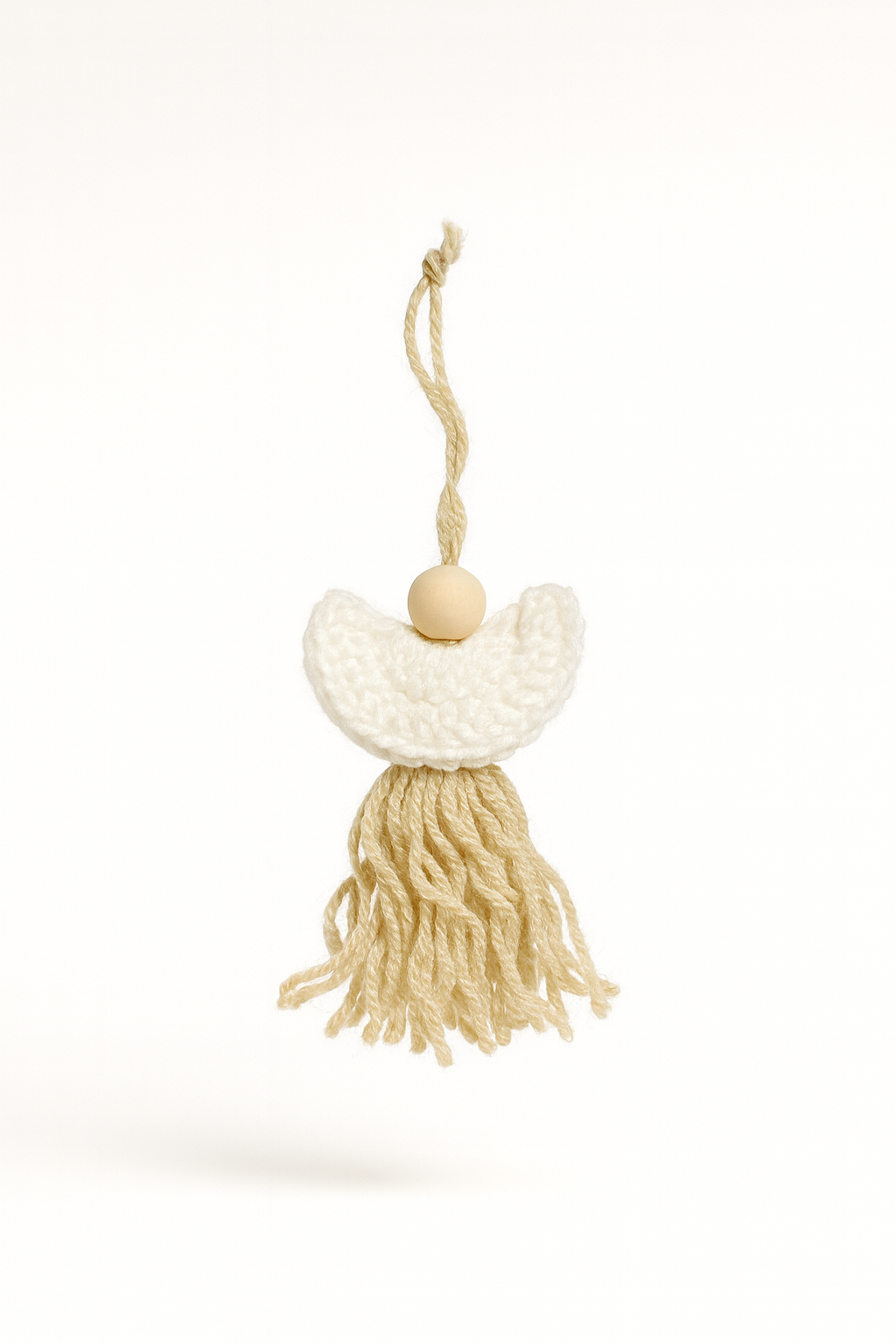 Handmade crochet angel ornament with wings and tassel in cream and natural tones