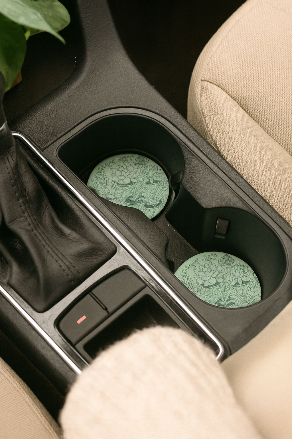Plant Lovers neoprene car coaster in vehicle cup holder showing fit and botanical design, set of 2