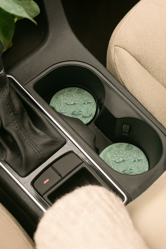 Plant Lovers neoprene car coaster in vehicle cup holder showing fit and botanical design, set of 2