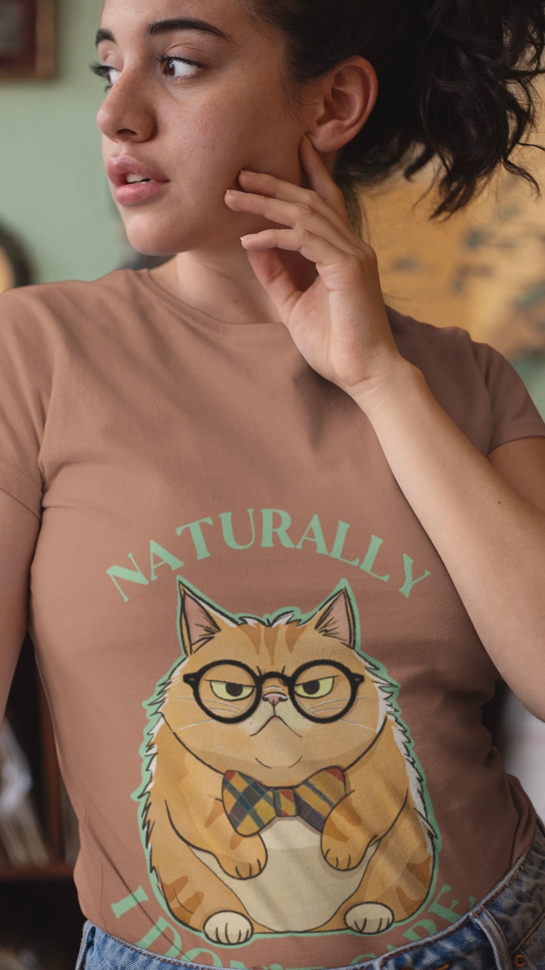 Woman wearing Naturally I Don't Care cat t-shirt in terracotta color with Mr. Grumps design, unisex cotton tee