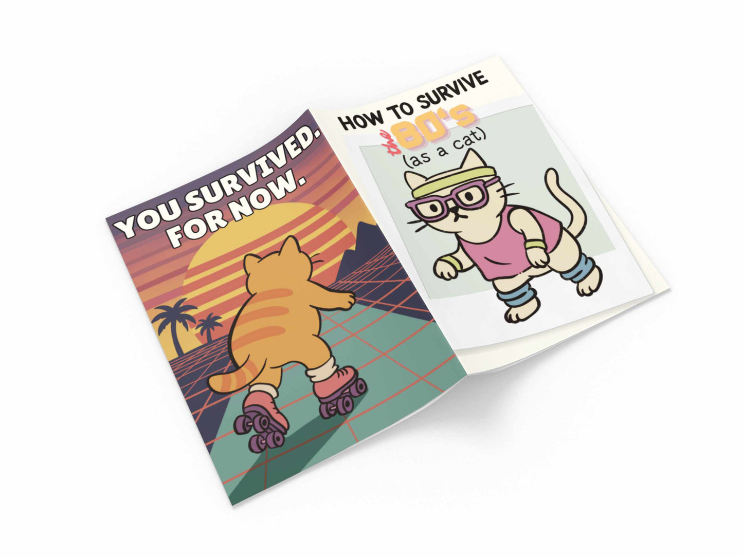 Open zine showing a roller-skating cat against a sunset with the words You Survived. For Now