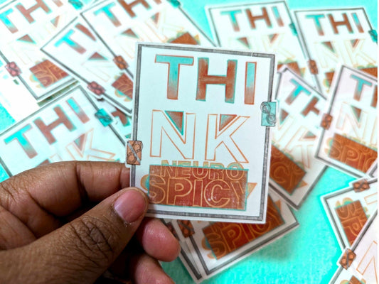 Think Neurospicy Sticker being held between fingers, showcasing its clear vinyl design and compact 3-inch size.