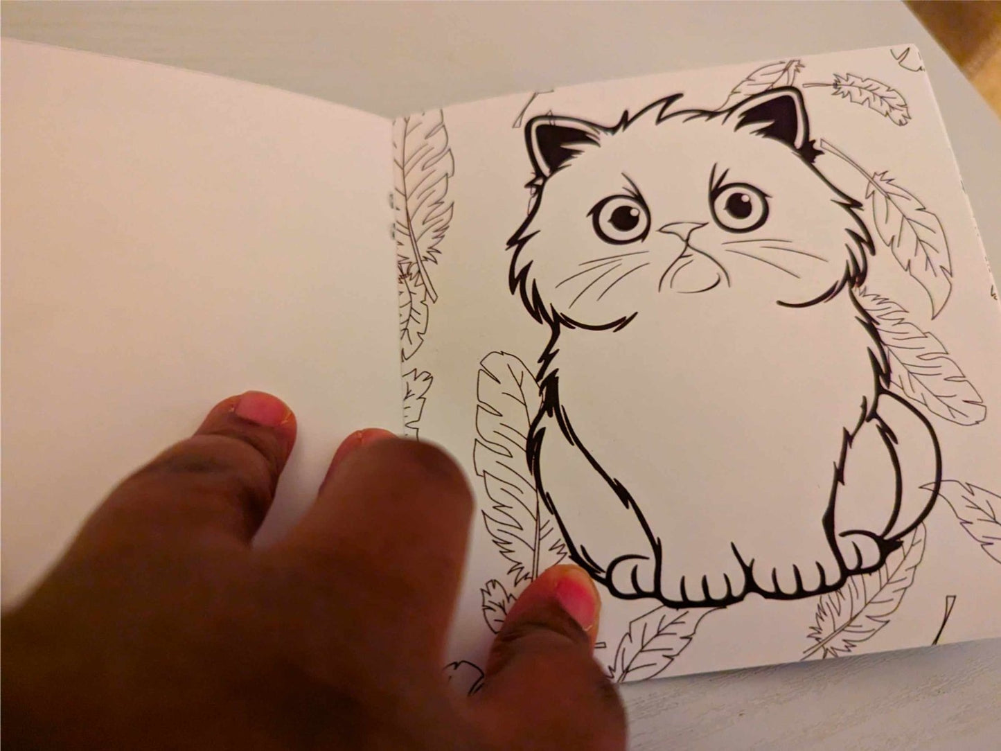 Interior coloring page from Its a Grumpy Life book showing fluffy cat with autumn leaves in line art ready to color