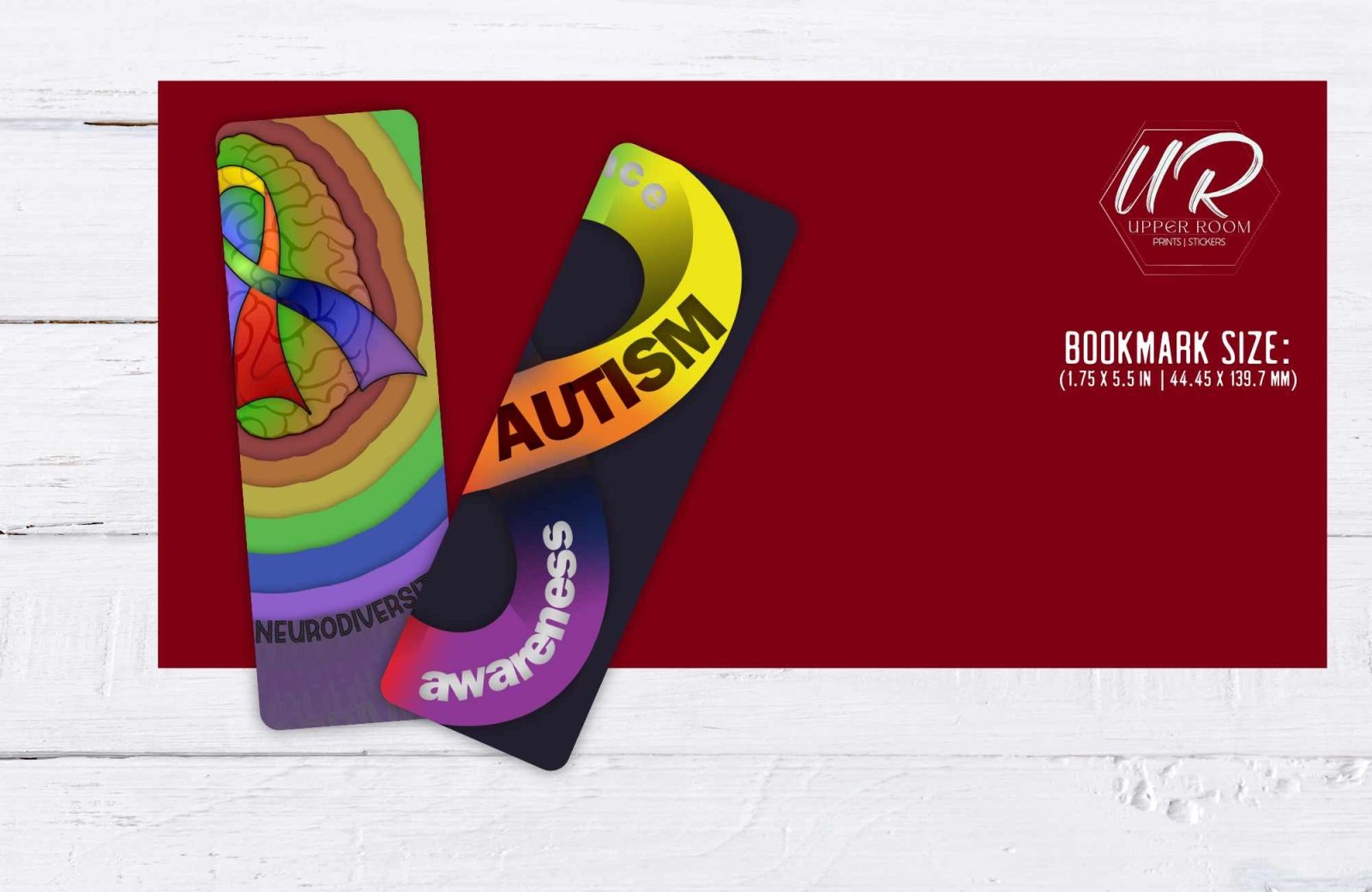 Two autism bookmarks displayed side-by-side with ruler to show size