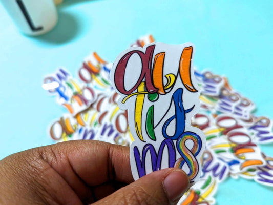 Autism Graffiti Sticker held in hand, showcasing its bold, colorful design on waterproof vinyl material.