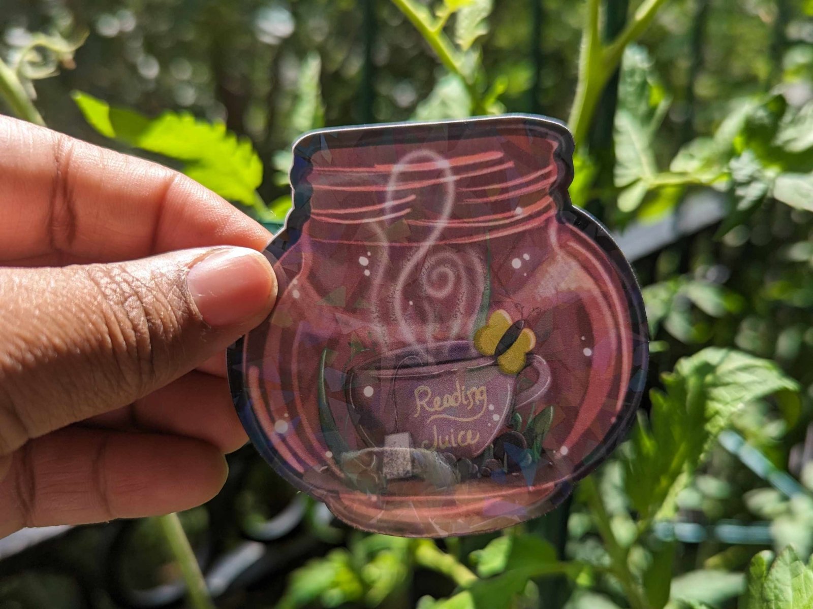 Round glow jar sticker with a whimsical, glowing holographic effect.