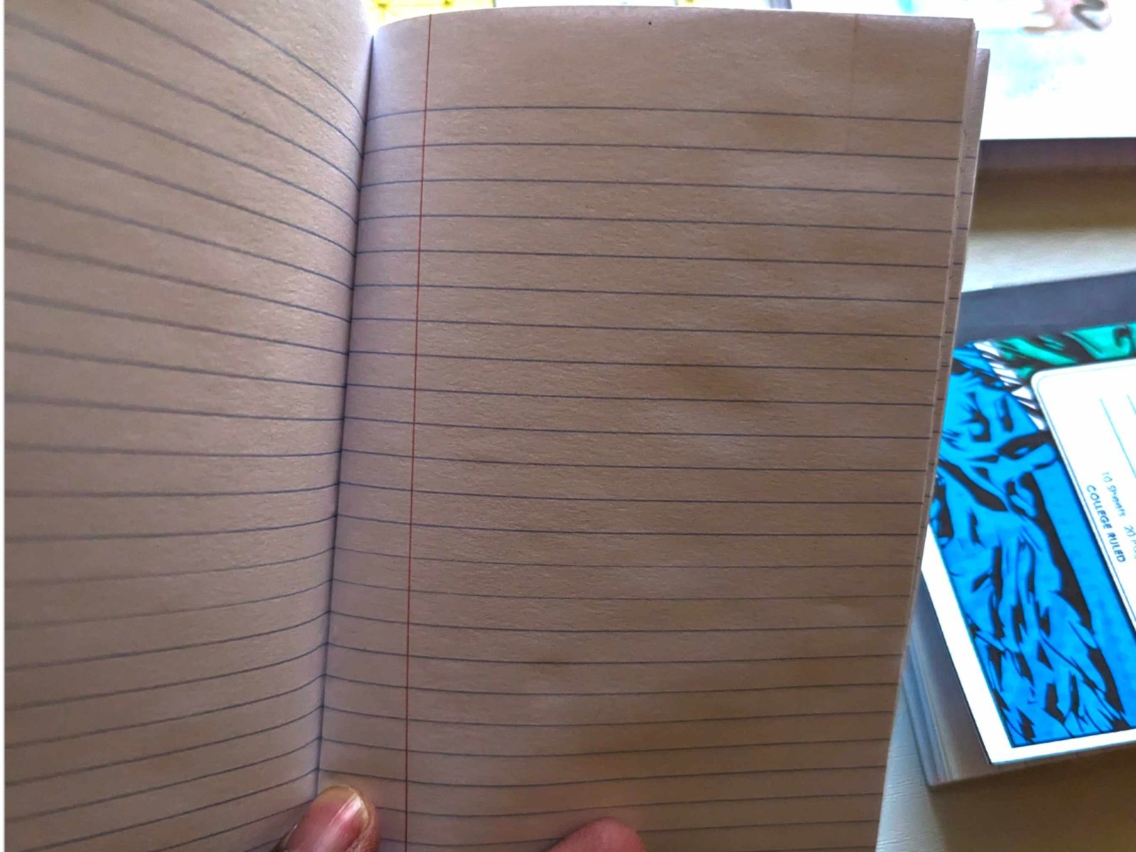 Interior view of the mini composition notebook showing 4x6 college-ruled lined pages.