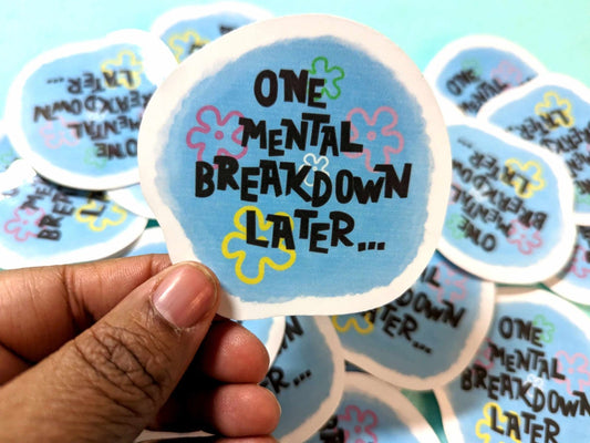 One Mental Breakdown Sticker held in hand, featuring a bold humorous design on waterproof vinyl material.