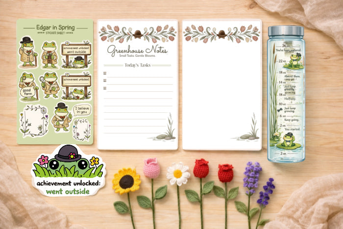 First Bloom Collection by Upper Room Prints featuring cottagecore stickers, greenhouse art print, notepad, and crochet flowers