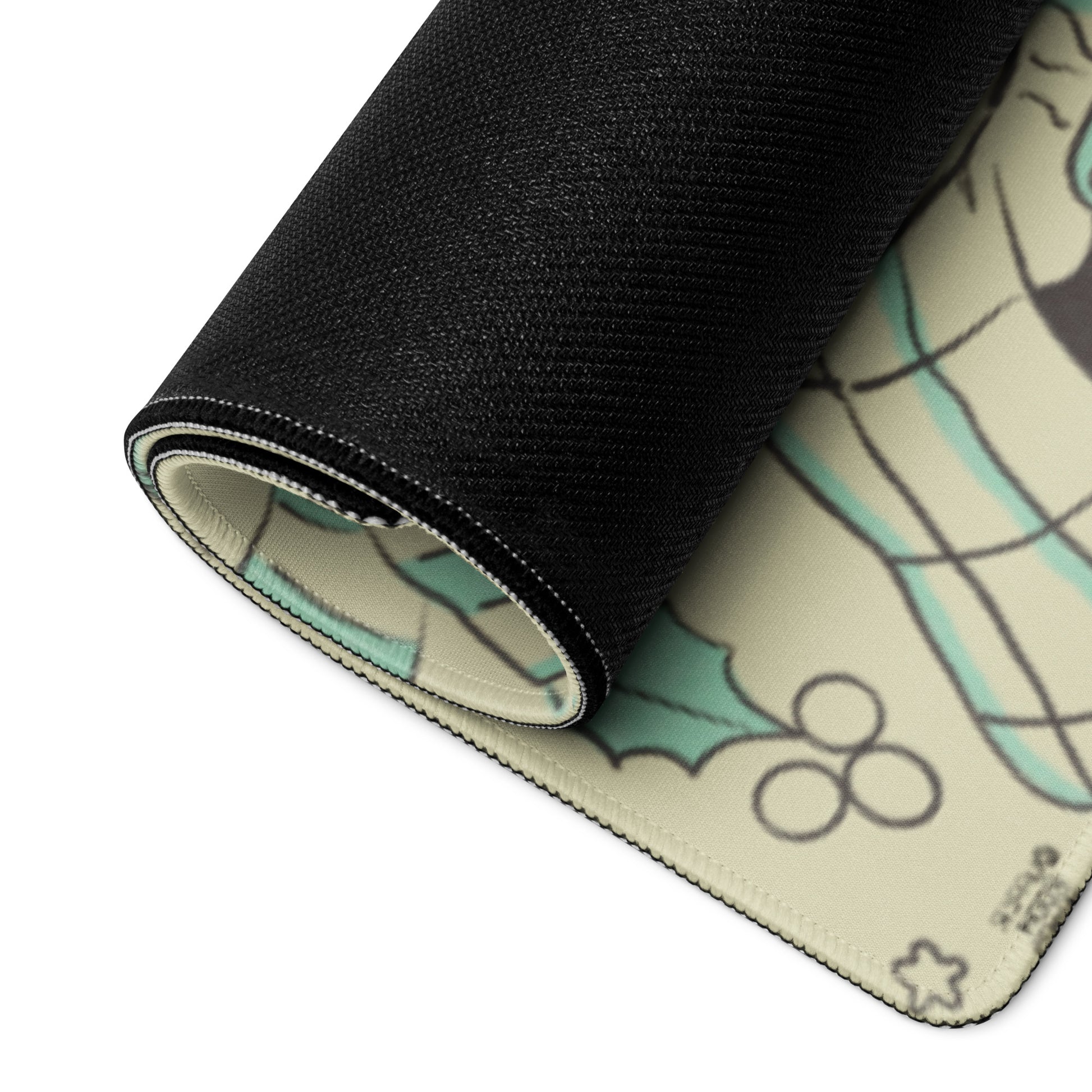 Close-up detail of cottagecore gaming mouse pad showing high-quality black stitched edges, non-slip rubber backing, and vibrant winter panda illustration with holly design