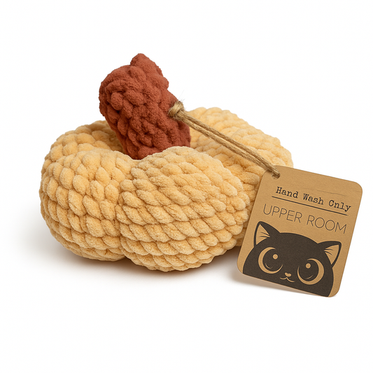 Handmade cream colored crochet pumpkin with rust orange stem and Upper Room Prints tag featuring black cat logo
