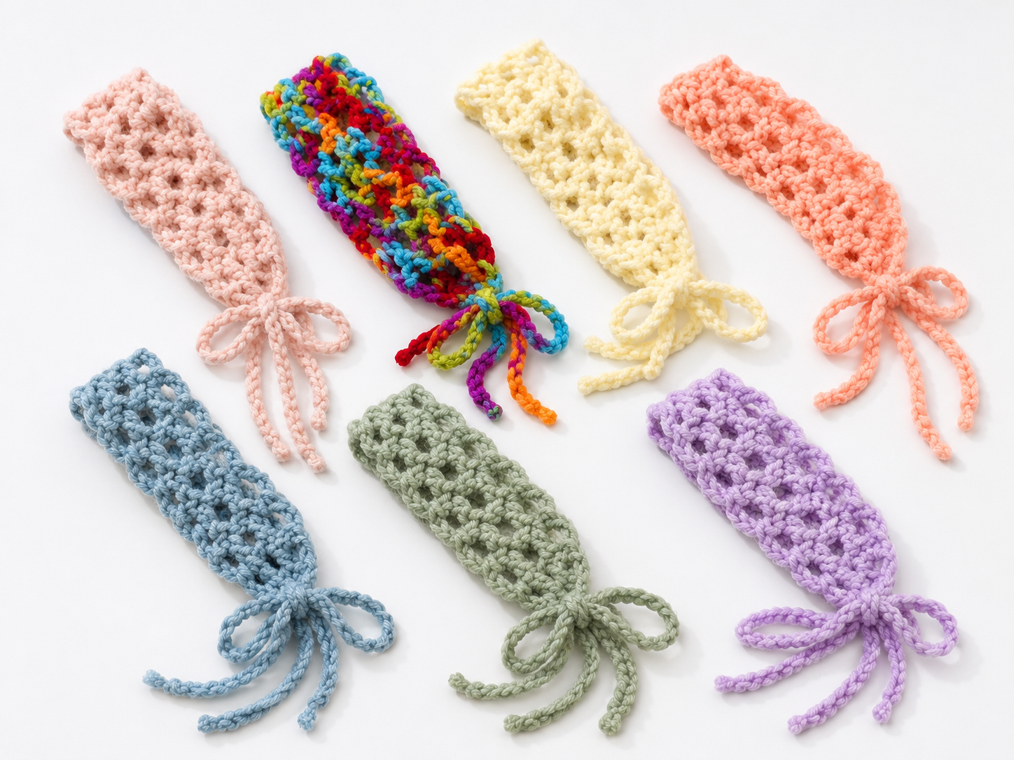 Colorful crocheted bookmarks on a white background