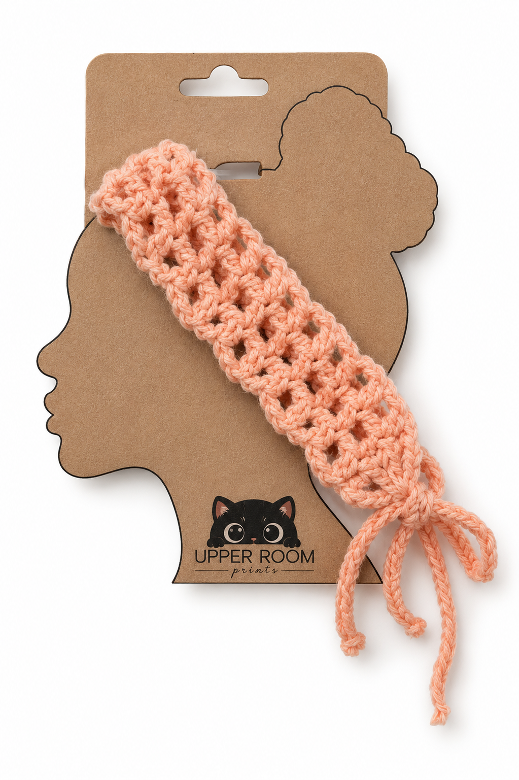 Crocheted headband on a cardboard packaging with 'Upper Room' branding.