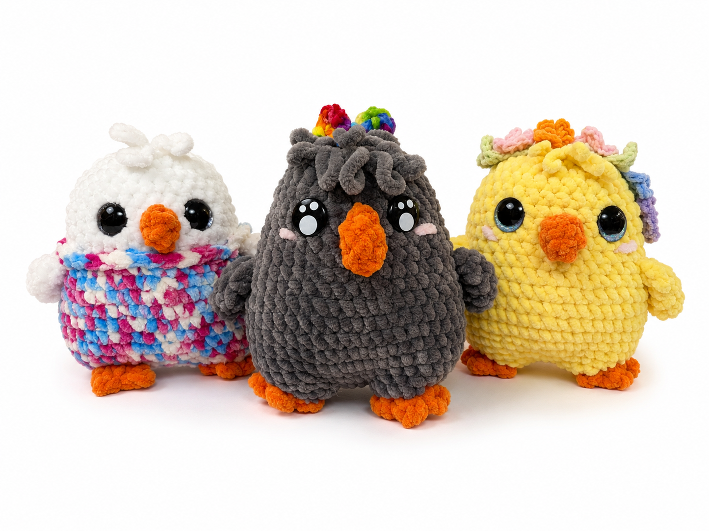 Three colorful crochet birds on a white background