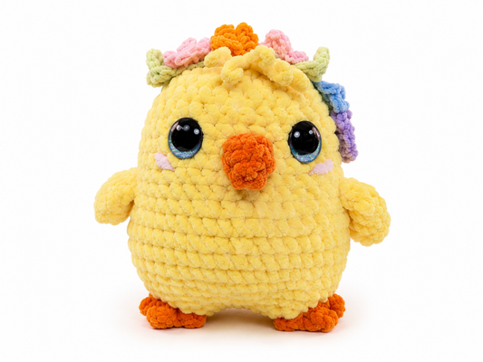 Yellow plush toy with colorful hair on a white background