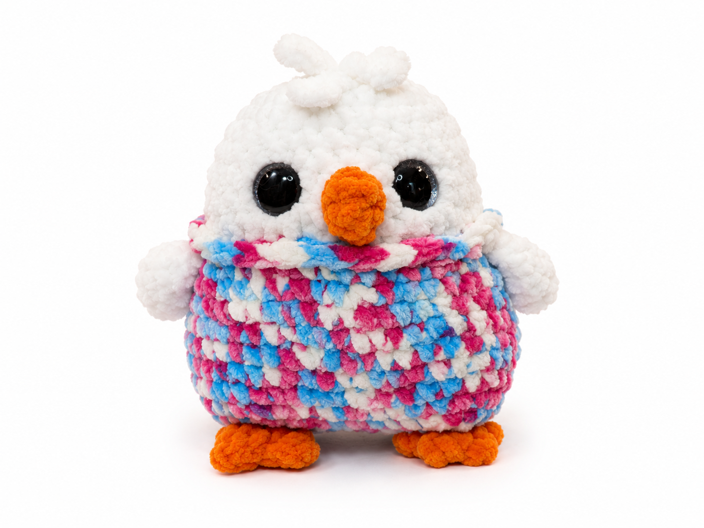 Crocheted owl plush toy with a multicolored pattern on a white background