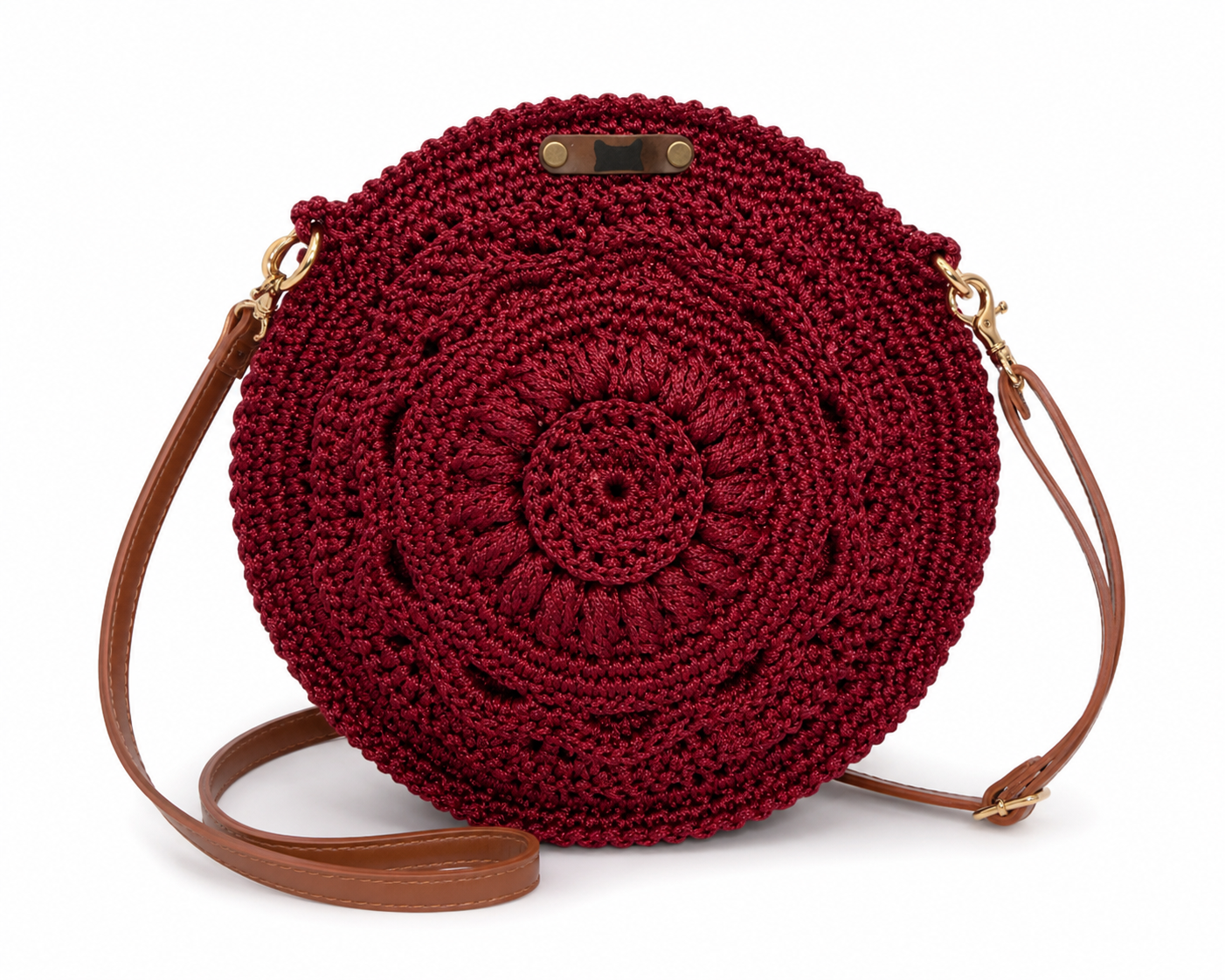 Round red crochet bag with brown strap on a white background