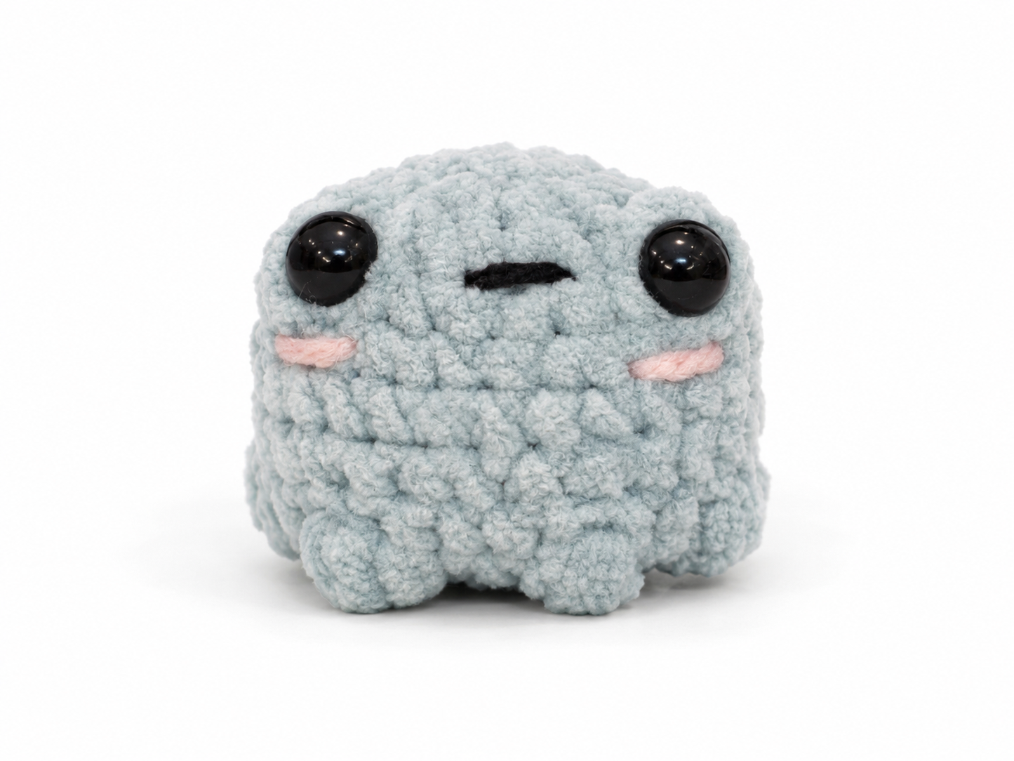 Plush toy with a sad expression on a white background