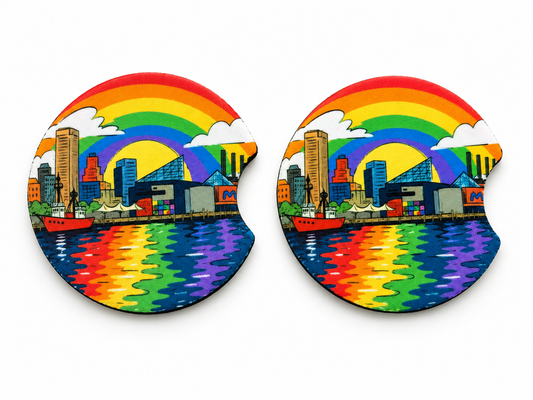 Two Baltimore Pride car coasters side by side on a white background, mirrored notches, overhead view