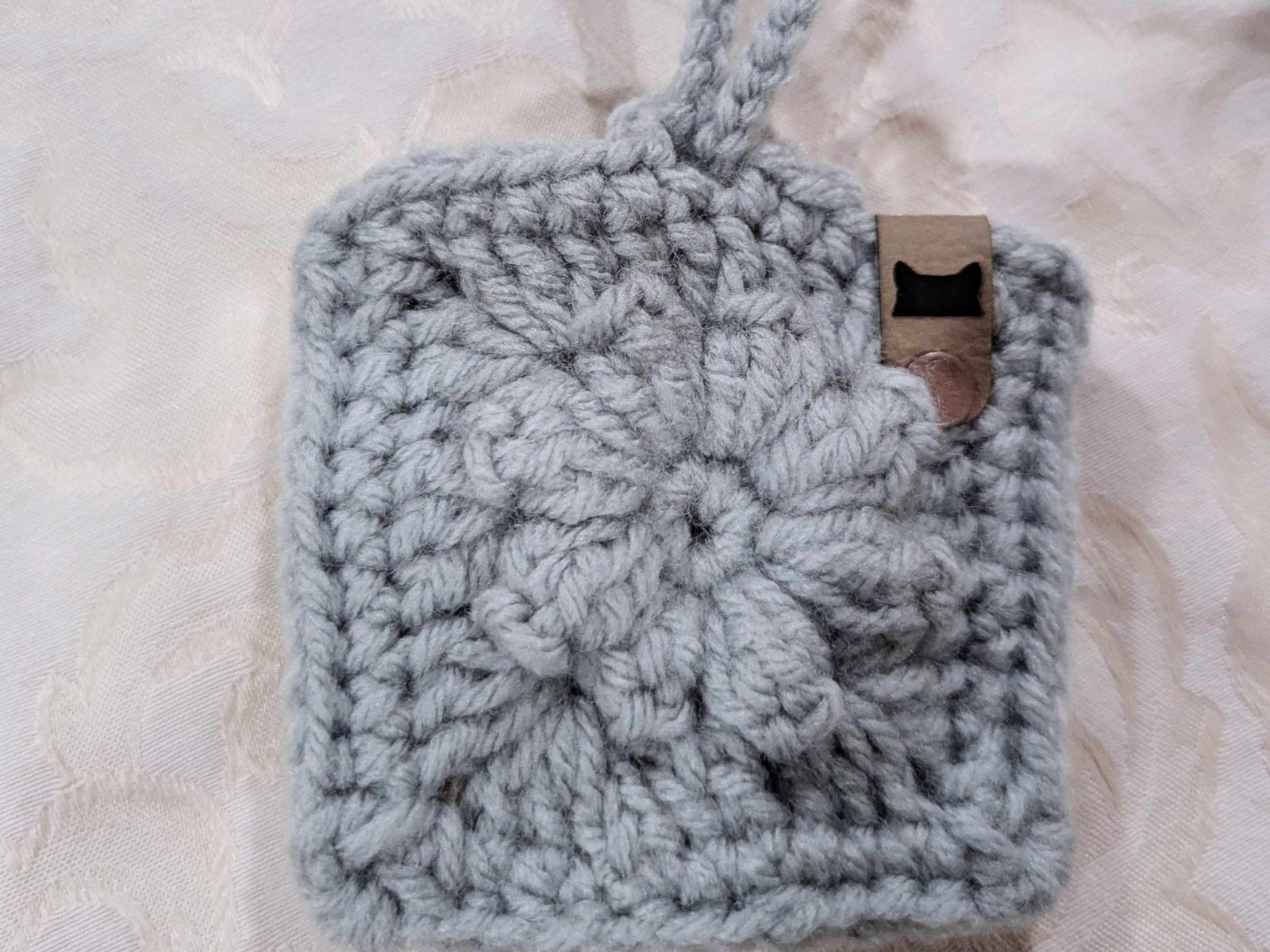 Hand-crocheted Boho Bag Charm in blue tones. A granny square purse accessory designed for bohemian and cottagecore fashion lovers.
