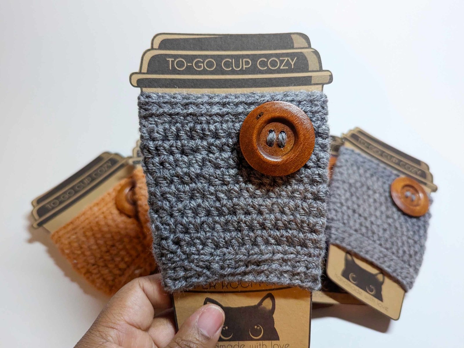 Grey Cozy Sweater Drink Cozy shown on its own as a fall-themed handmade cup sleeve.