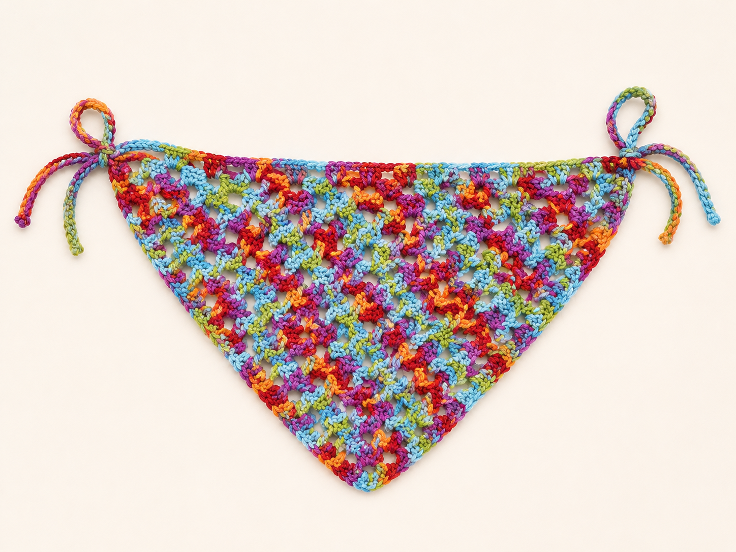 Colorful floral-patterned bikini top on a white background