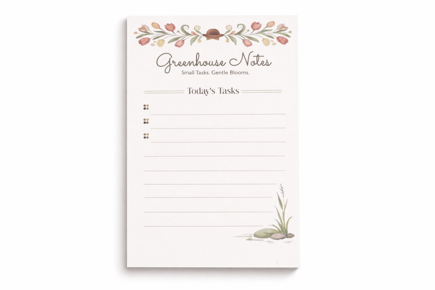 Notepad with 'Greenhouse Notes' branding and floral design on a white background
