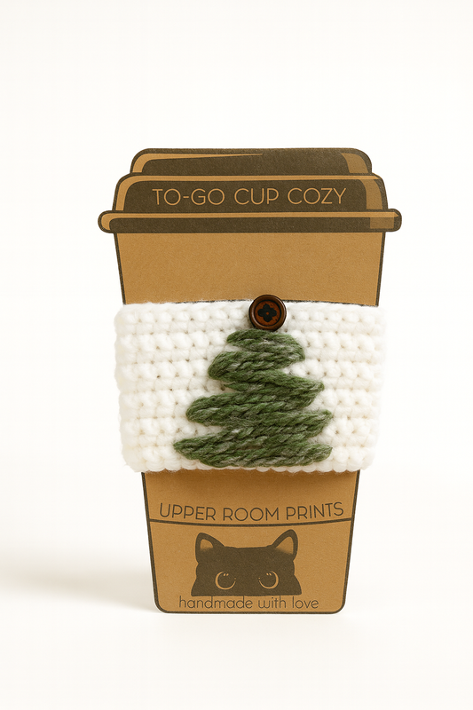 Handmade crochet Christmas mug cozy in white and green speckled yarn with wooden button closure