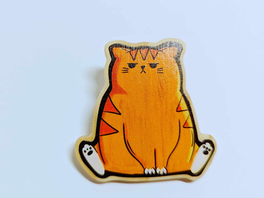 Mr. Grump Cat wooden pin – a 2-inch handcrafted wooden pin featuring a grumpy orange cat with a heart clasp and black rubber stopper, perfect for cat lovers and pin collectors.