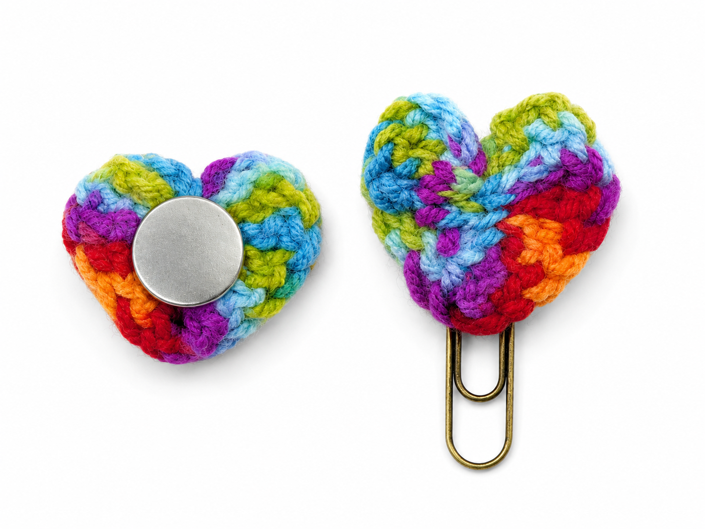 Two colorful heart-shaped crocheted clips on a white background