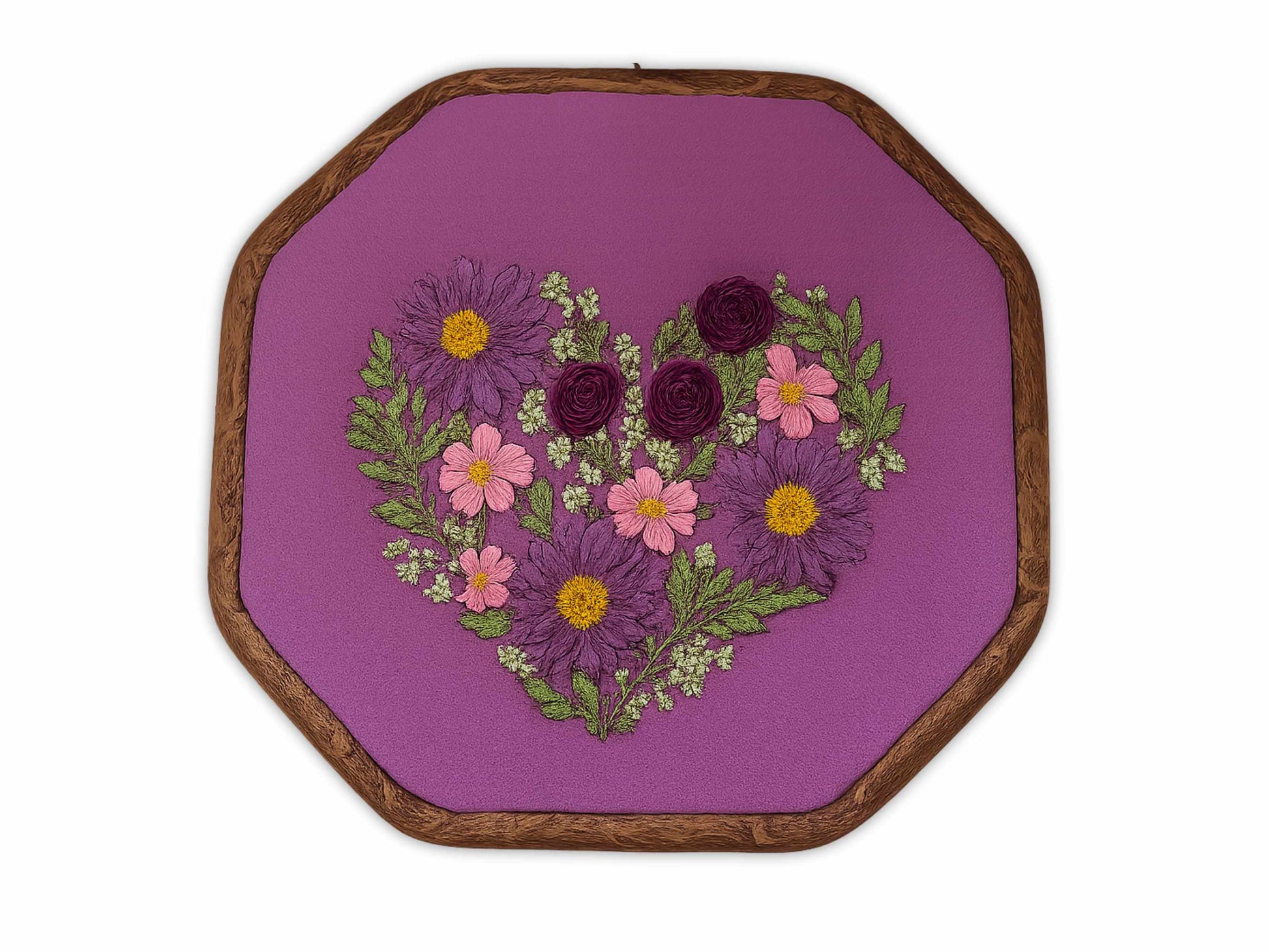 Purple embroidery hoop art with heart-shaped arrangement of burgundy roses, pink cosmos, and purple daisies on rich purple linen fabric