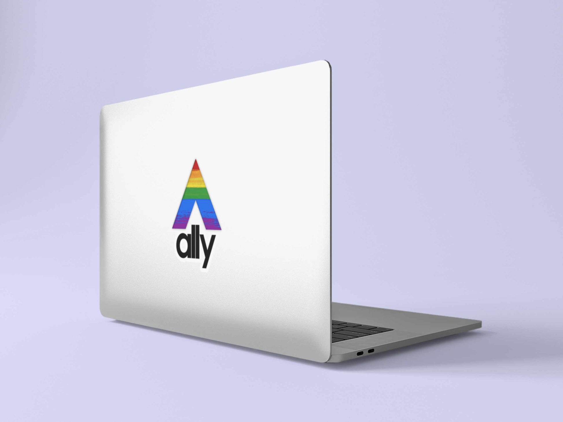 Rainbow flag ally sticker on silver laptop, showing support for LGBTQ+ community with minimalist pride decal