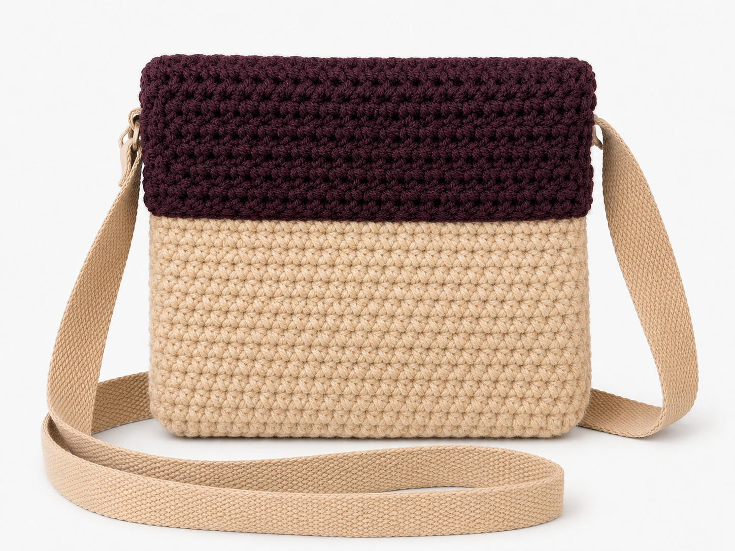 Crocheted bag with two-tone design on a white background
