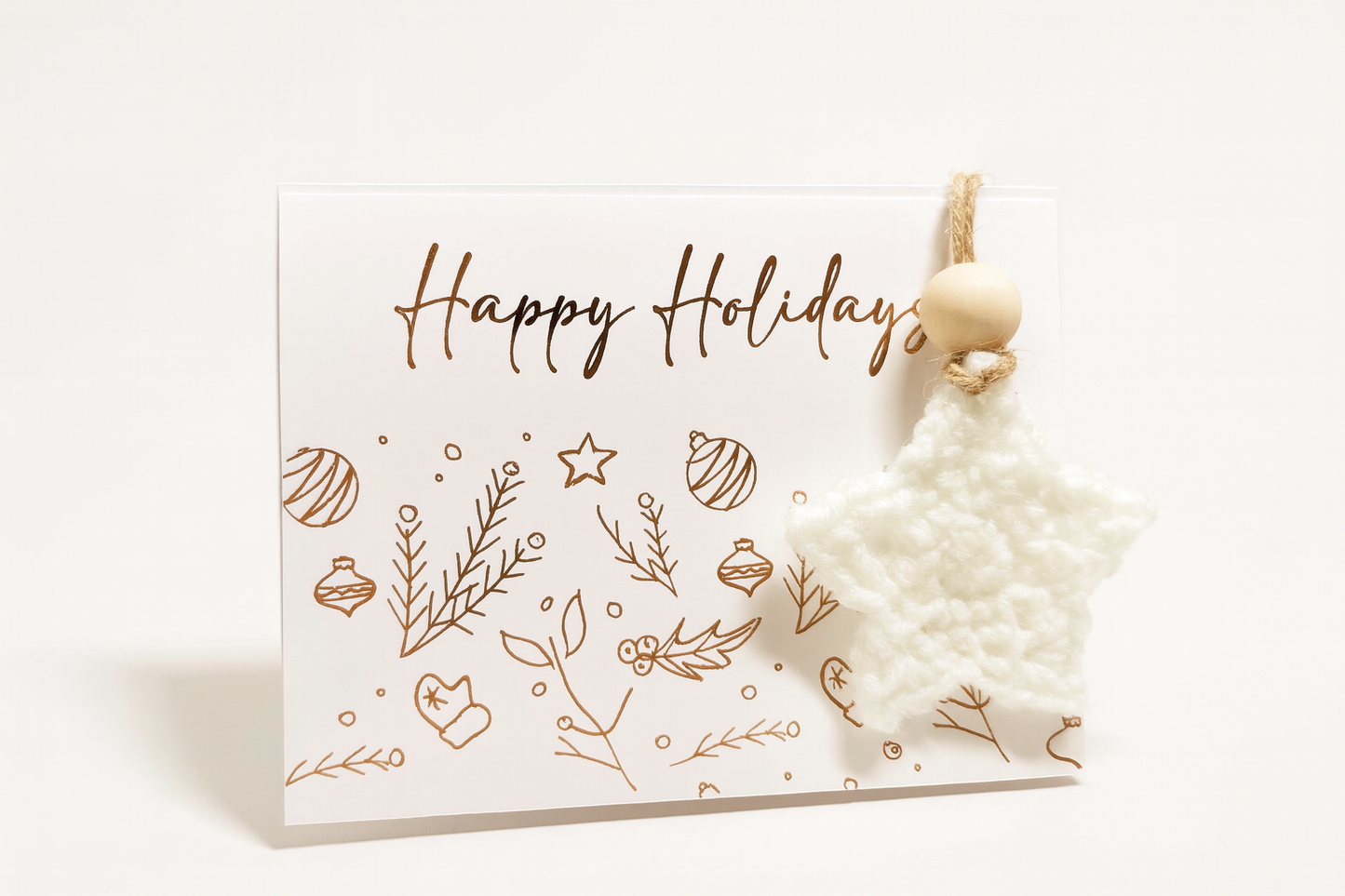 Rose gold boho star Christmas card with matching white crochet ornament, elegant holiday gift set