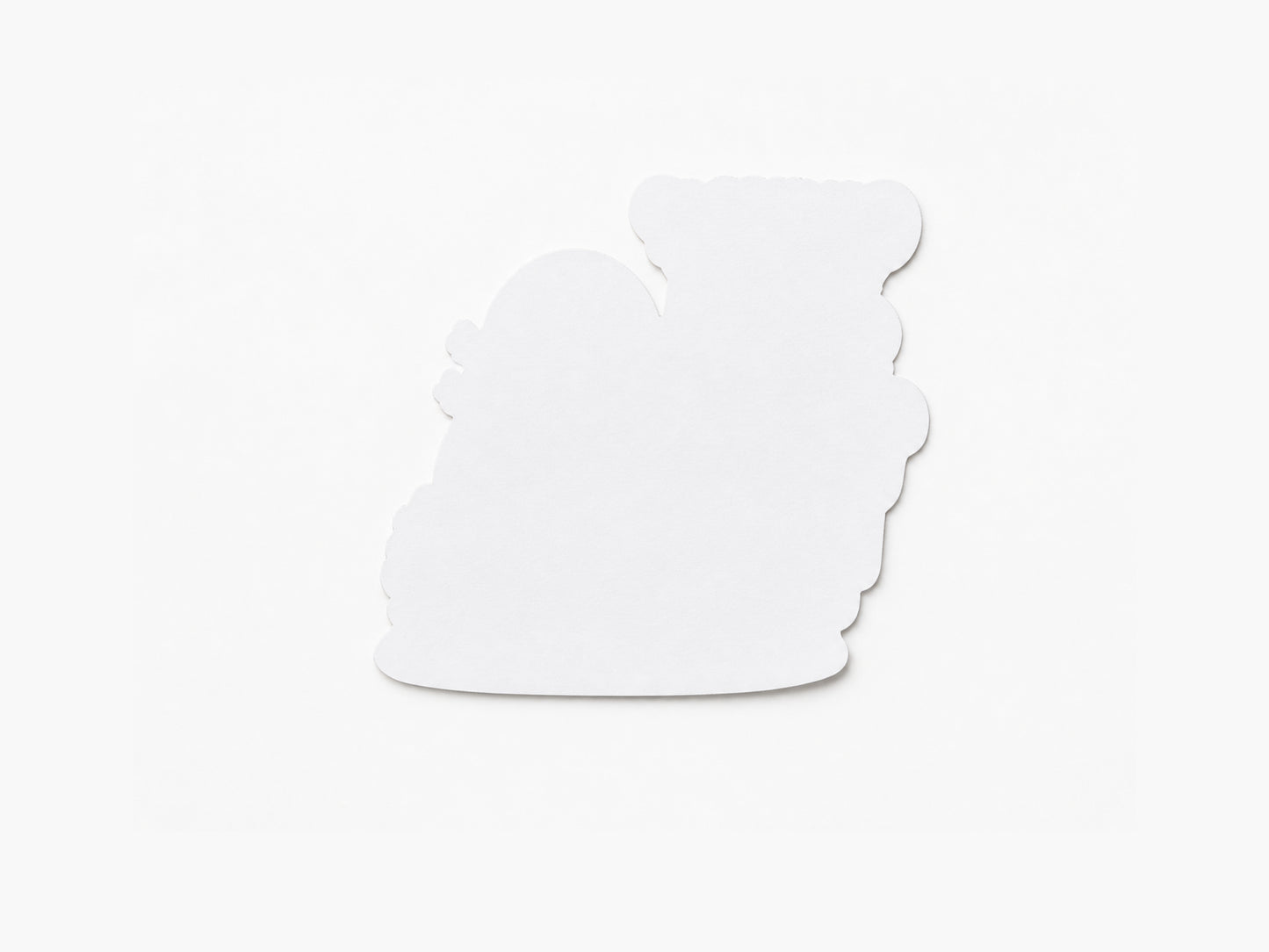 Back view of Wilbur turtle sticker showing plain white backing and die cut shape