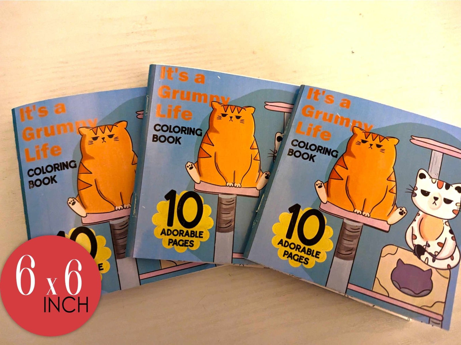 Its a Grumpy Life coloring book cover featuring Mr. Grumps orange cat on scratching post with 10 adorable pages in 6x6 inch size

